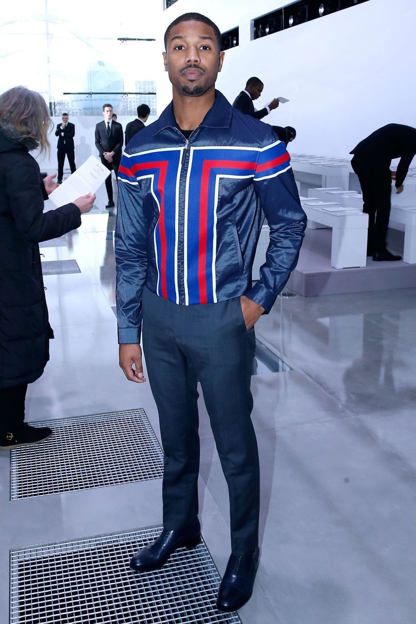 Lewis Hamilton Wears Louis Vuitton Souvenir Jacket and Sneakers at