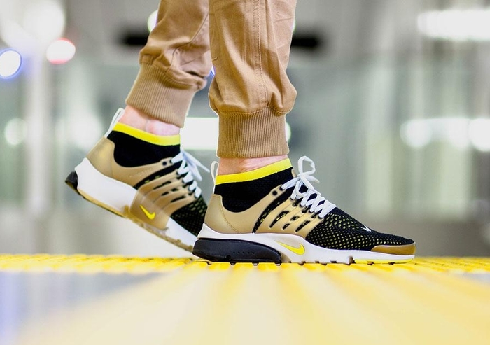 black and yellow nike presto