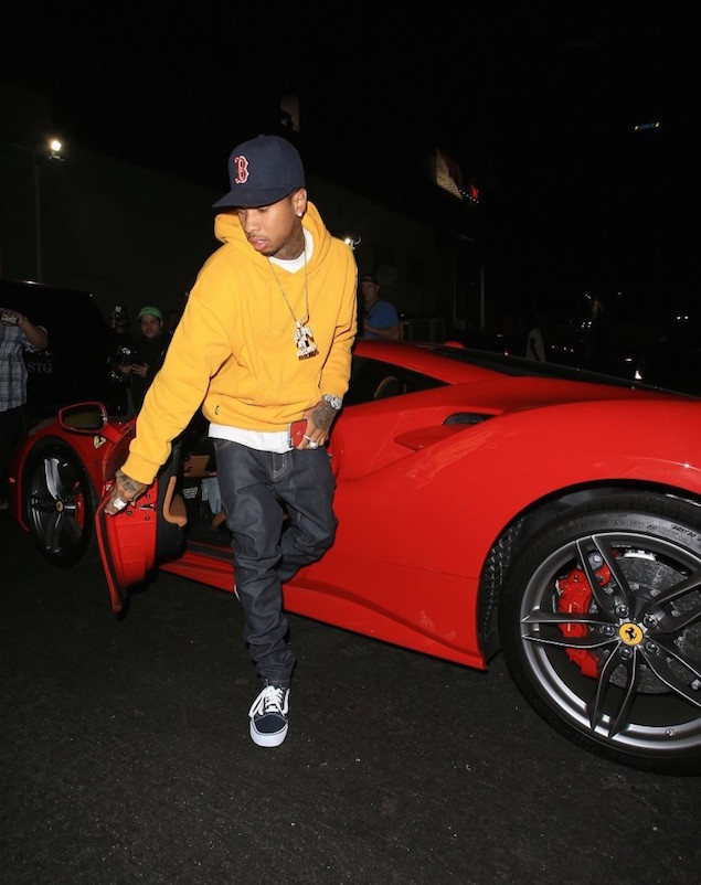 Tyga-Hops-Out-Of-His-Ferrari-wearing-Gosha-Rubchinskiy-Yellow-Hoodie-2