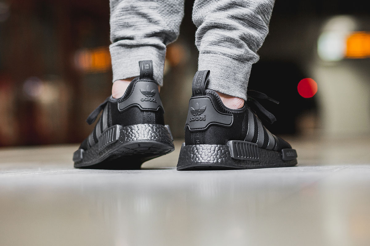 Nmd triple black on foot best sale