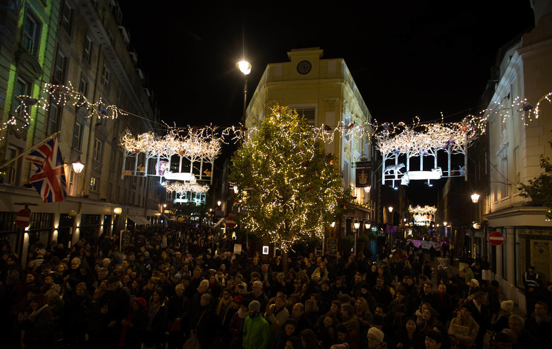 EDITORIAL USE ONLY Crowds gather in preparation for the woodland themed Seven Dials Christmas lights switch on that features 250 twinkling Christmas animals, and coincides with an exclusive traffic free festive shopping event, in London. PRESS ASSOCIATION Photo. Picture date: Thursday November 17, 2016. Designed by James Glancy Design, the Christmas light installation consists of 190 silver birch trees with sparkling LED branch lights, and inhabits a stag, polar bear, brown bear, foxes, arctic wolf, badger, squirrels, rabbits, hedgehogs, owl, robins and blue-tits. Photo credit should read: David Parry/PA Wire