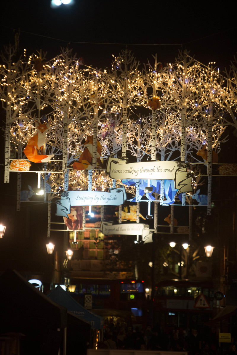 EDITORIAL USE ONLY Crowds enjoy the woodland themed Seven Dials Christmas lights switch on that features 250 twinkling Christmas animals, and coincides with an exclusive traffic free festive shopping event, in London. PRESS ASSOCIATION Photo. Picture date: Thursday November 17, 2016. Designed by James Glancy Design, the Christmas light installation consists of 190 silver birch trees with sparkling LED branch lights, and inhabits a stag, polar bear, brown bear, foxes, arctic wolf, badger, squirrels, rabbits, hedgehogs, owl, robins and blue-tits. Photo credit should read: David Parry/PA Wire