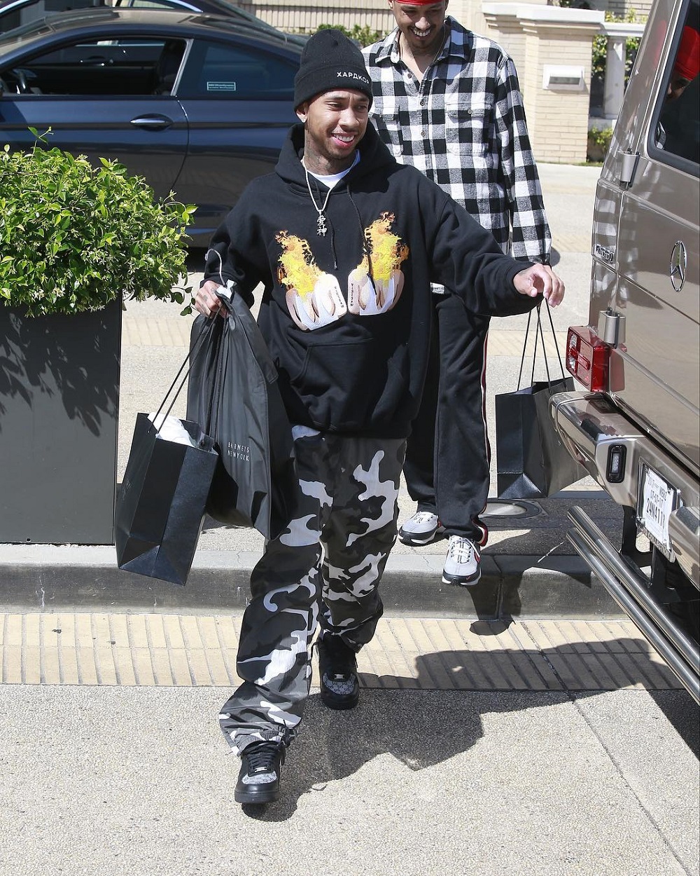SPOTTED: Tyga in Pharrell x Louis Vuitton Wears Millionaire Sunglasses and  Louis Vuitton Shirt