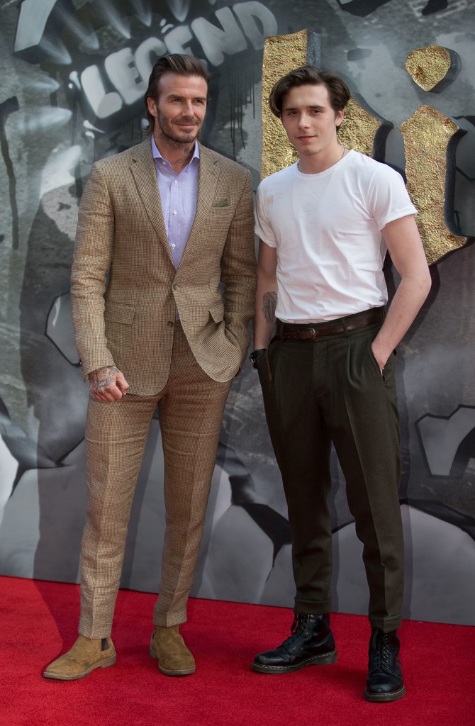 Brooklyn Beckham Attends Kent & Curwen Presentation With Dad David