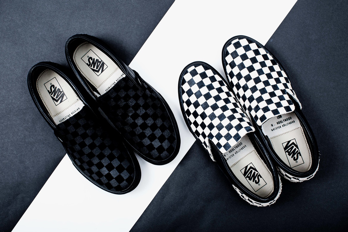 vans black on black checkerboard slip ons