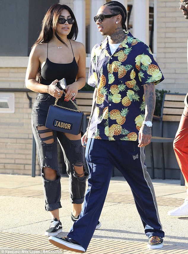 SPOTTED: Tyga In Prada Shirt, Martine Rose Shorts and Carrying