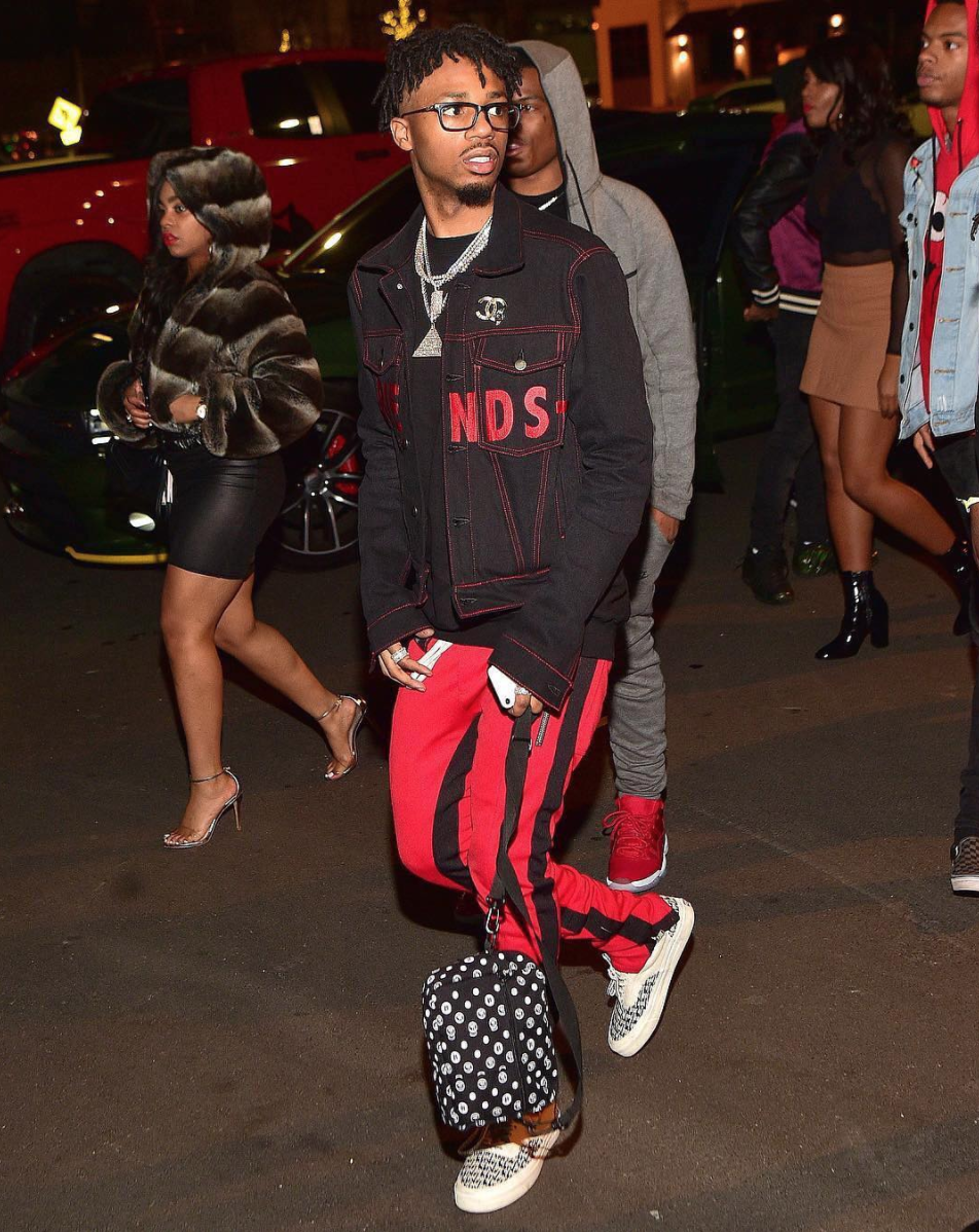 Metro Boomin stylin his black outfit with Louis Vuitton briefcase